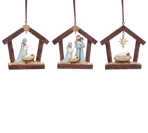 Three nativity scene ornaments hanging against a white background