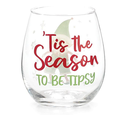 A clear stemless wine glass with a festive holiday graphic featuring a green elf and the text "'Tis the Season TO BE TIPSY" in red and green lettering, set against a plain white background.