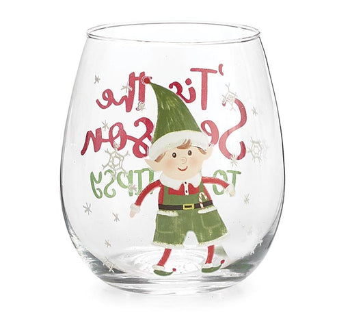 A clear stemless wine glass featuring a festive Christmas design with a cartoon elf and the phrase 'It is the season to this day' in red and green lettering, set against a plain white background.