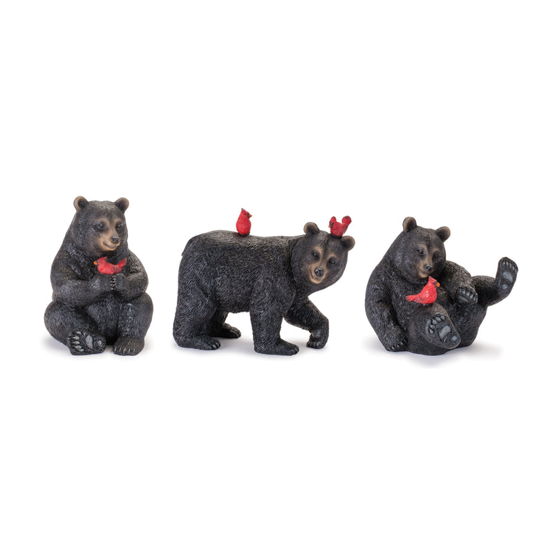 Three bear figurines with red birds on a white background