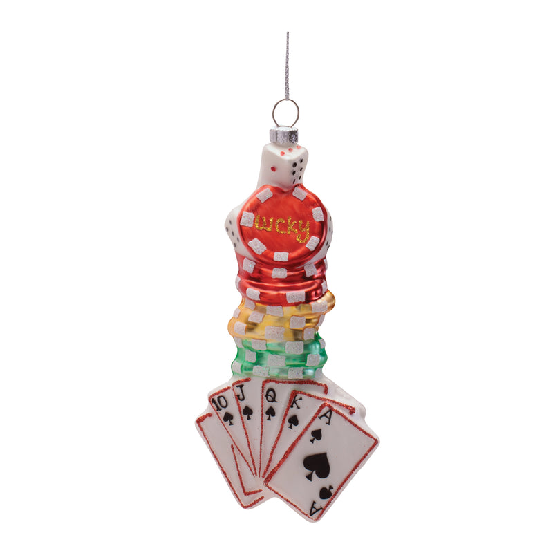 Decorative ornament with poker chips, cards, and a die on a white background