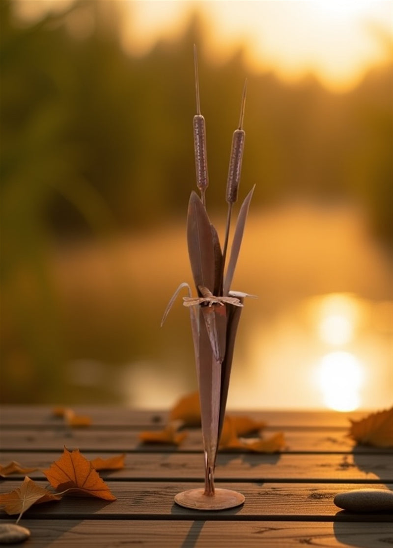 Decorative plant sculpture on a wooden surface with a blurred natural background