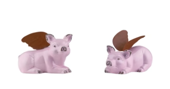 Two pink animal figurines with brown wings on a white background