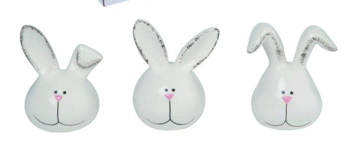 Three white bunny face plush toys with black eyes and pink noses on a white background.