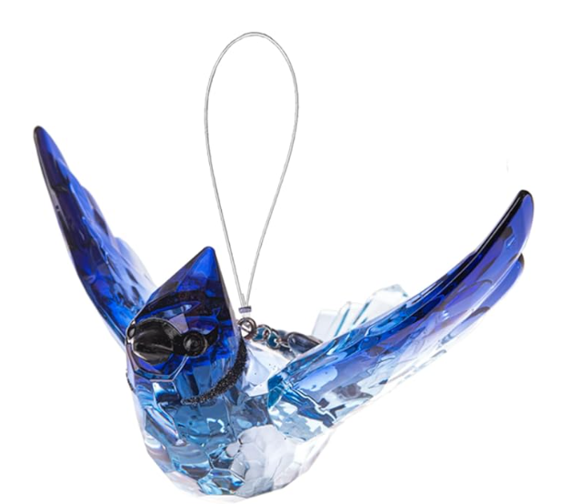 Blue glass bird ornament on a white background