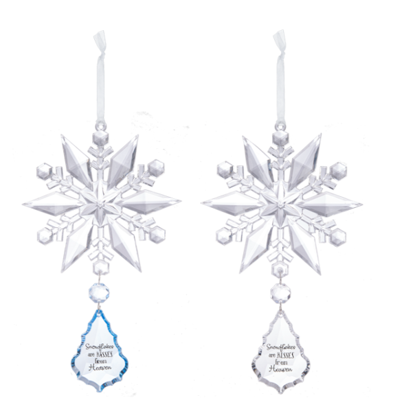 Two snowflake-shaped Christmas ornaments with hanging elements on a white background