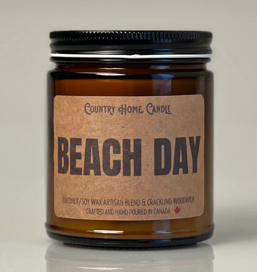 Candle jar labeled 'Beach Day' by Country Home Candle on a neutral background