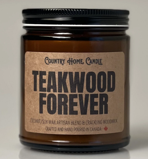 Candle jar labeled 'Teakwood Forever' by Country Home Candle on a neutral background