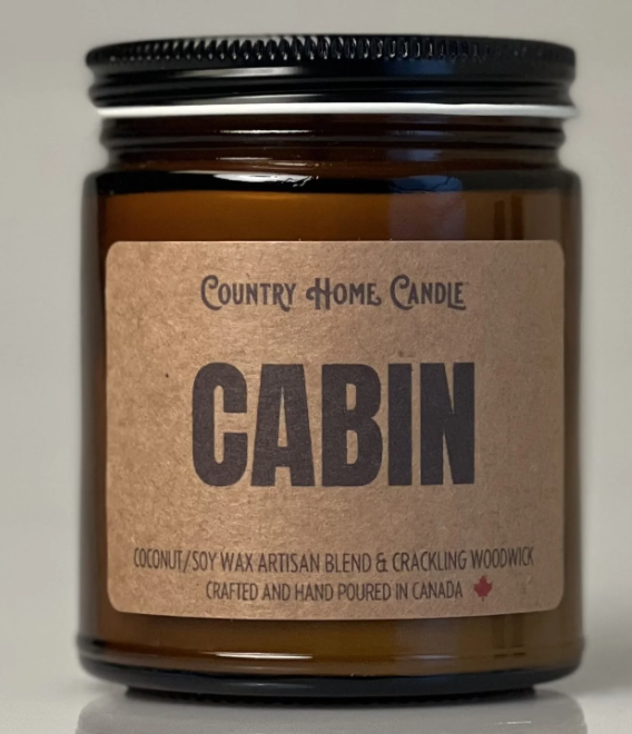 Brown candle jar with 'Country Home Candle' label on a neutral background