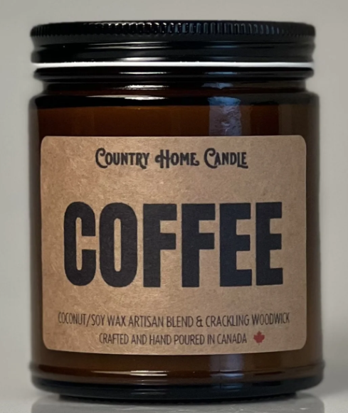 Brown candle jar with 'Coffee' label on a neutral background