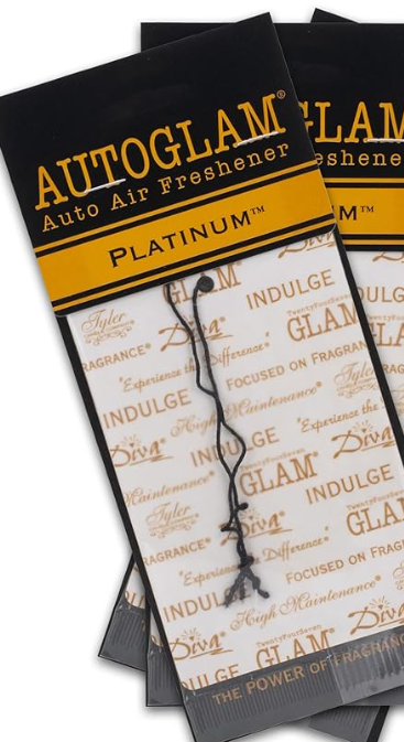 Packaging of Tyler Auto Glam Car Air Freshener with luxurious gold and black design, featuring text and brand branding.