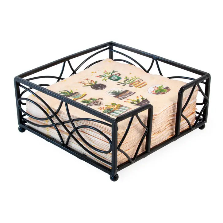 Black metal napkin holder with decorative napkins on a white background