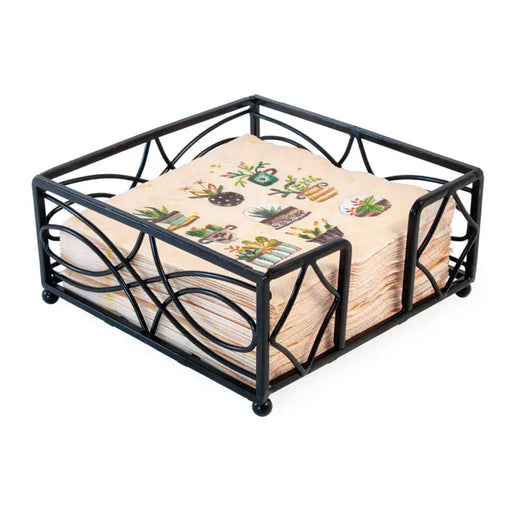 Black metal napkin holder with decorative napkins on a white background
