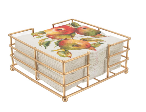 Gold metal napkin holder with floral design on white background