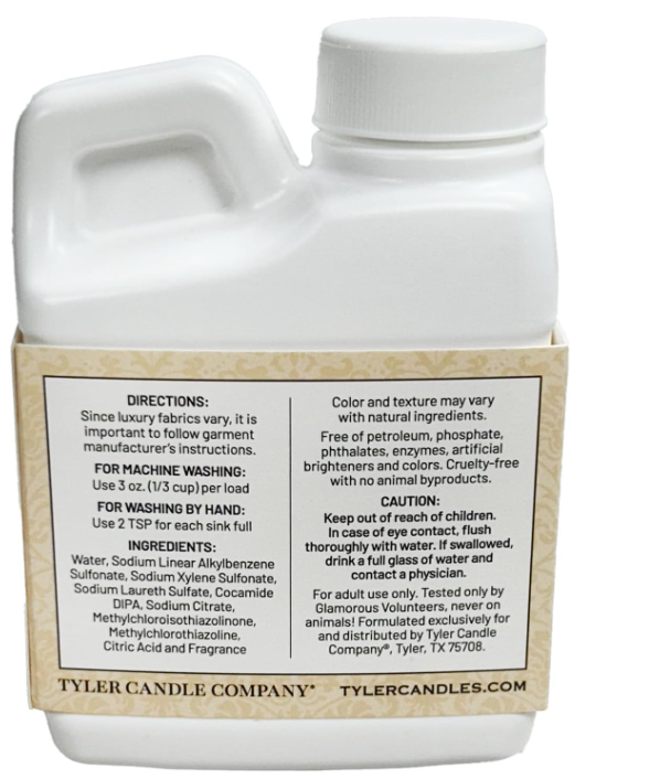 White bottle with label from Tyler Candle Company on a white background