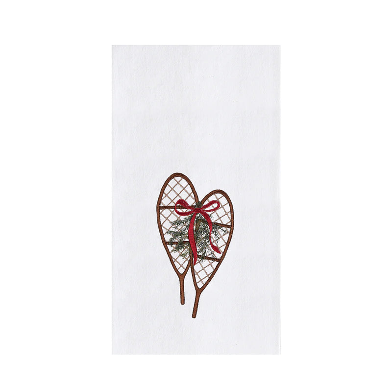 Heart-shaped snowshoe with a red bow on a white background