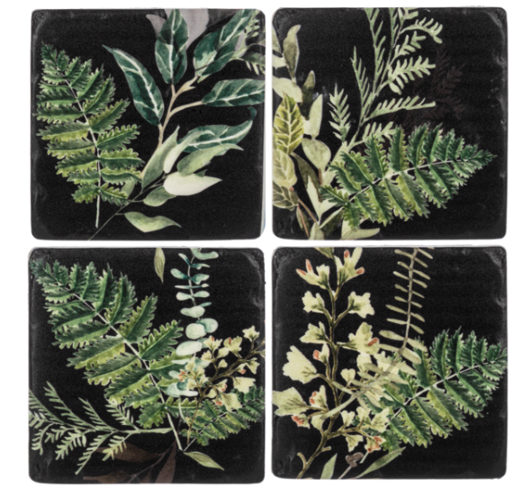 Set of four coasters with green leaf designs on a black background