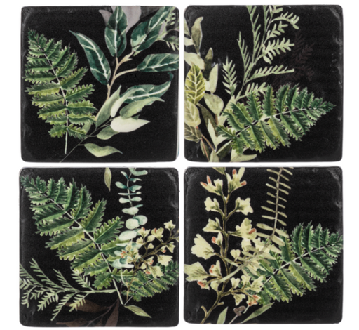 Set of four coasters with green leaf designs on a black background
