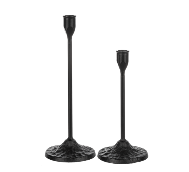 Two black candle holders on a white background