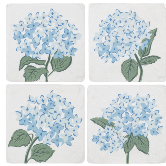 Four ceramic coasters with blue hydrangea flower design on a white background