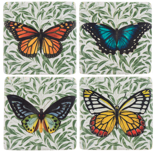 Four coasters with butterfly designs on a leafy green background