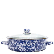A round enamel lidded casserole dish with a blue and white marbled pattern, featuring side handles and a glass lid with a blue and white patterned knob.