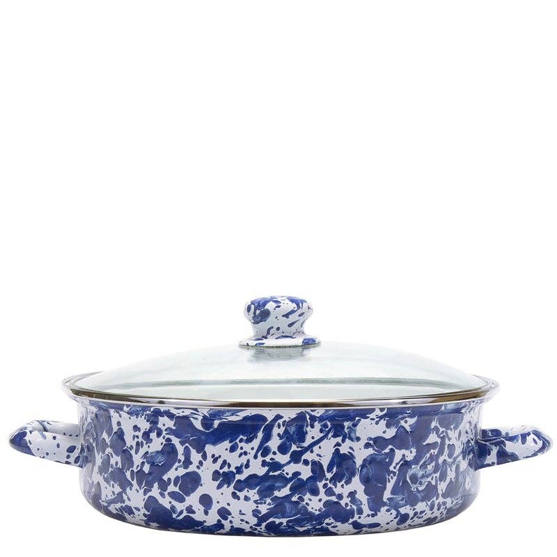 A round enamel lidded casserole dish with a blue and white marbled pattern, featuring side handles and a glass lid with a blue and white patterned knob.