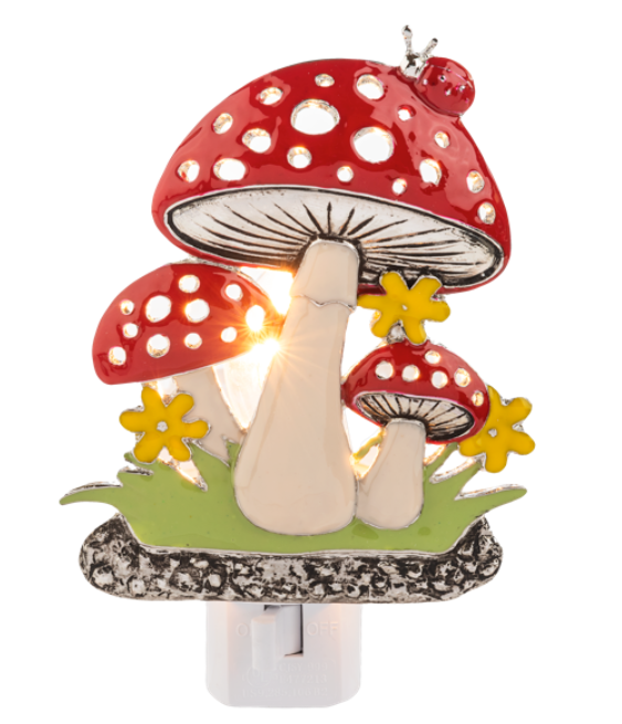 Mushroom-shaped night light with red caps and white spots on a white background