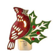 Decorative night light with a red bird and green holly leaf design on a white background