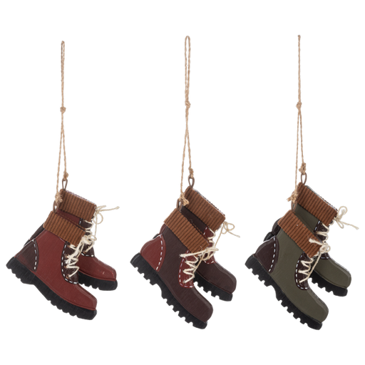 Three pairs of hanging boots on a white background