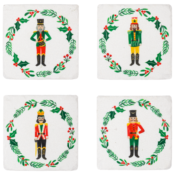 Four square coasters with Christmas-themed designs of nutcrackers and holly leaves.