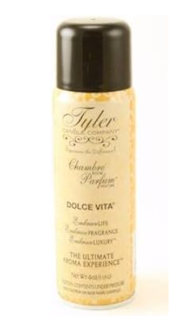 A bottle of 'Chambre Parfum' room perfume by Tyler Candle Co. with the label indicating it is the French Market fragrance.