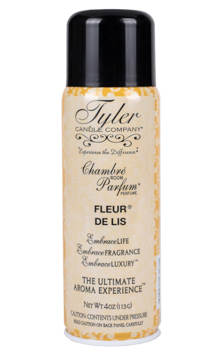 A bottle of 'Chambre Parfum' room perfume by Tyler Candle Co. with the label indicating it is the French Market fragrance.