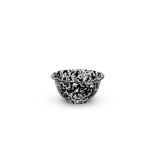 A black and white marble splattered small footed enamel bowl.