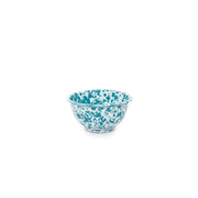 A turquoise and white marble splattered small footed enamel bowl.