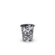 Black and white speckled cup on a white background