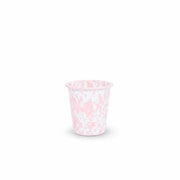 Pink and white patterned cup on a white background