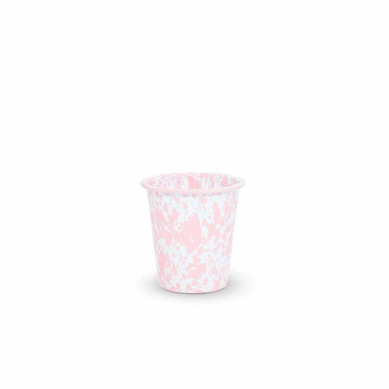 Pink and white patterned cup on a white background