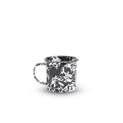 Black and white speckled mug on a white background