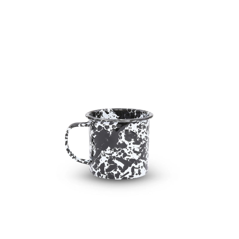Black and white speckled mug on a white background