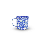 Blue and white speckled mug on a white background