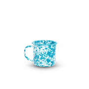 Blue and white speckled mug on a white background