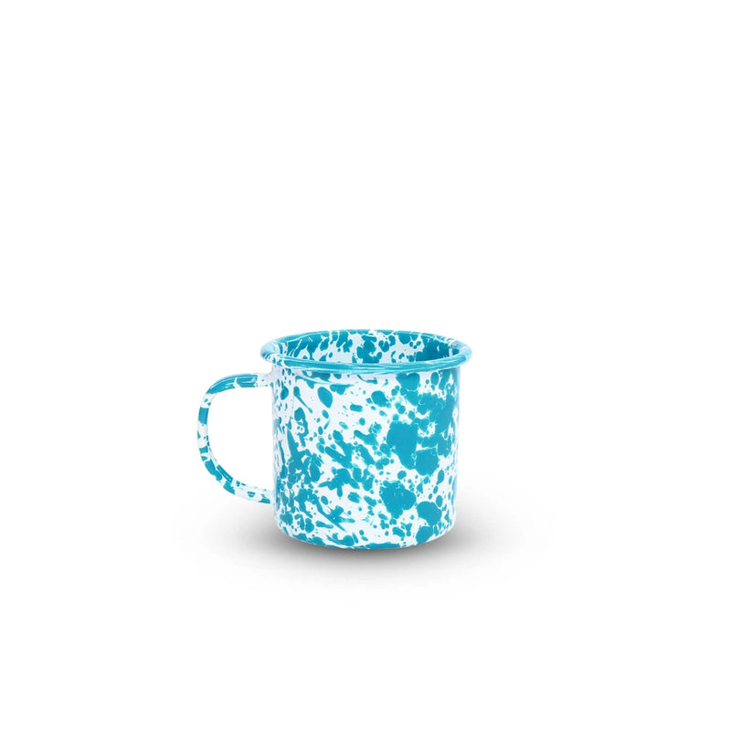 Blue and white speckled mug on a white background