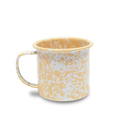 Yellow and white patterned mug on a white background