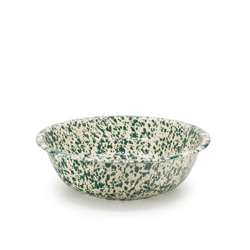 Speckled green and beige ceramic bowl on a white background
