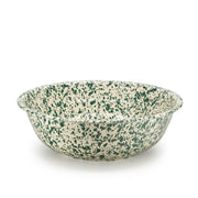 Speckled green and beige bowl on a white background