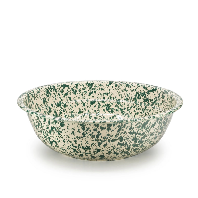 Speckled green and beige bowl on a white background