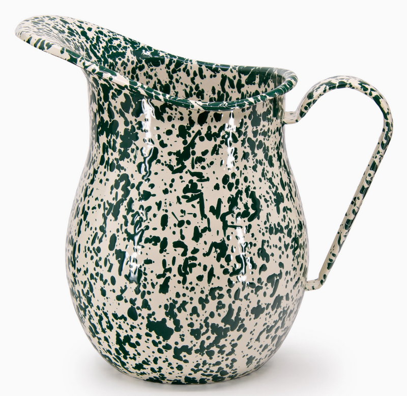 Speckled green and white pitcher on a white background