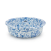 Blue and white speckled enamel bowl on a white background