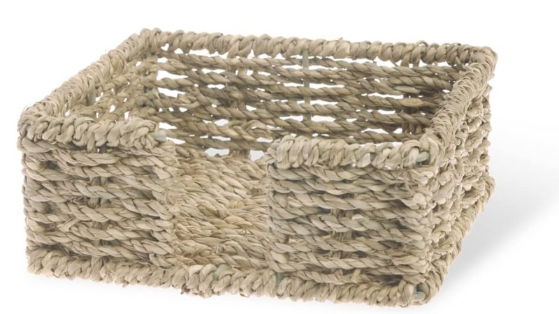 Woven rectangular basket made of natural fibers on a white background